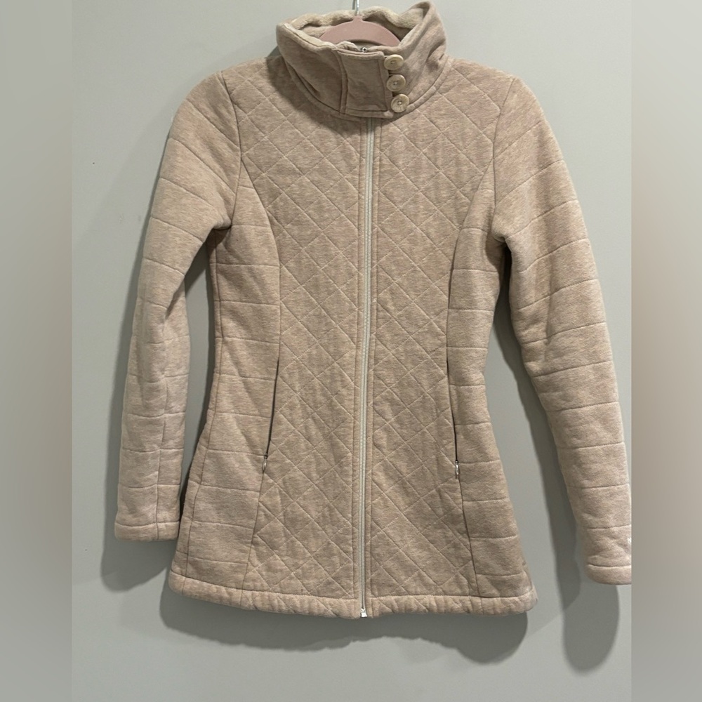 Women’s North face zip up oatmeal jacket.